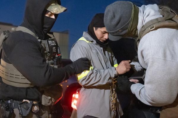 U.S. Immigration and Customs Enforcement officers use chains to hold immigrant during arrest, January 25, 2025, Silver Spring, MD
