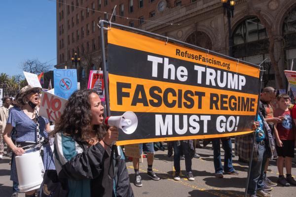 At the "Fight Fascism" rally in San Francisco, Refuse Fascism had a banner with the slogan "The Trump Fascist Regime Must Go!"