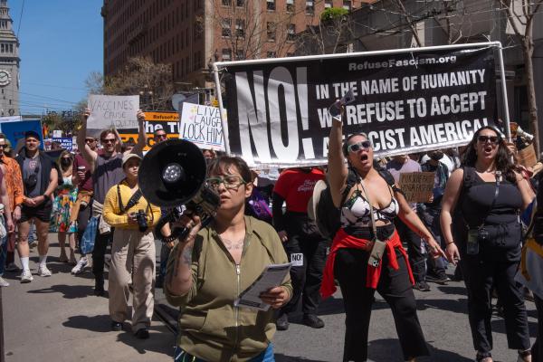 The banner In The Name Of Humanity, We Refuse to Accept A Fascist America!" received prominent coverage in the SF Chronicle, April 12, 2025.