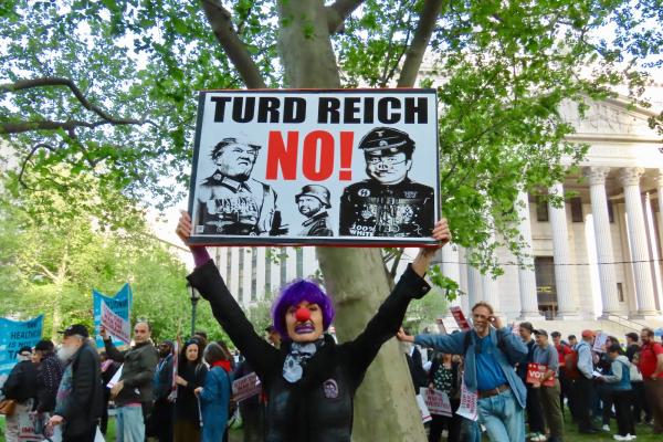 May Day protest in New York City. Poster says "Turd Reich NO!"
