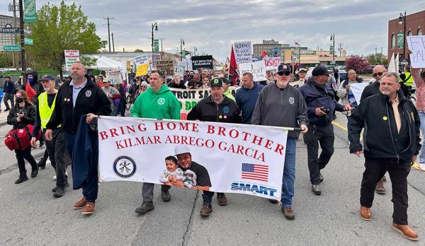 Detroit union members hold banner for Kilmar on May Day.