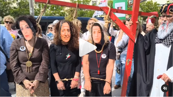 Protest in Spain against Iran executions. Shown are three women with nooses, wearing masks of female political prisoners sentenced to death in Iran.