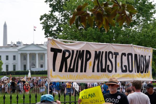 RF banner at fence around White House on May Day, Washington, DC.
