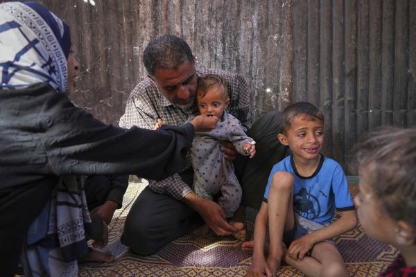 Palestinian family feeds malnourished children in Khan Younis.