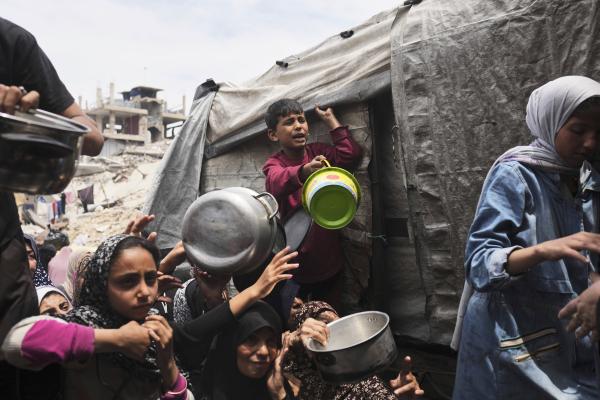 Palestinians struggle to get food in Jabalia, northern Gaza Strip, May 15, 2025.