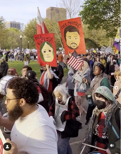 May Day march Boston. Posters say "Free Rumeysa" and "Free Mahmoud"