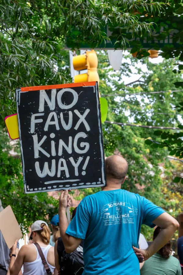 Sign at No Kings protest says "No Faux King Way!"