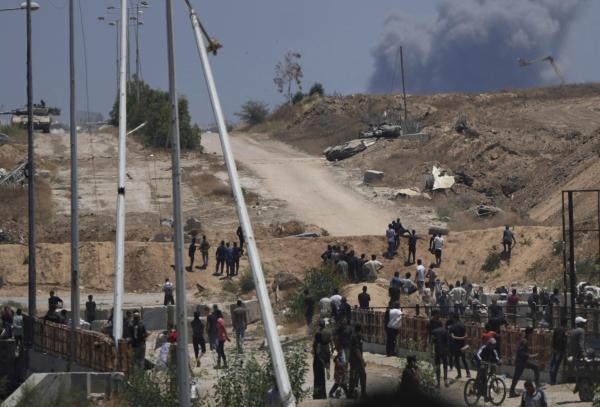 Smoke rises from Israeli firing on Gaza food distribution site in Khan Younis, May 29, 2025.