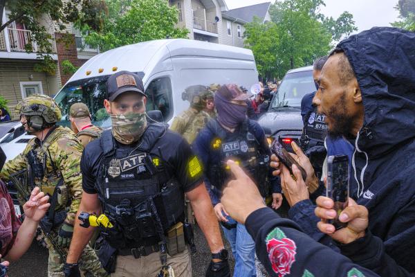 Protesters confront ICE, ATF, and FBI officers in Minneapolis, June 3, 2025.