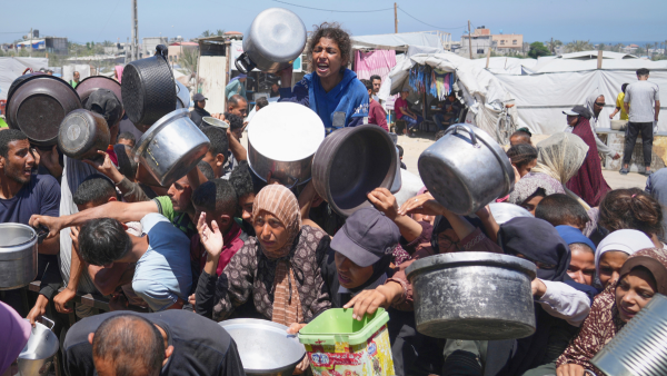 Starving Palestinians struggle to receive food in Khan Younis, Gaza, May 23, 2025.