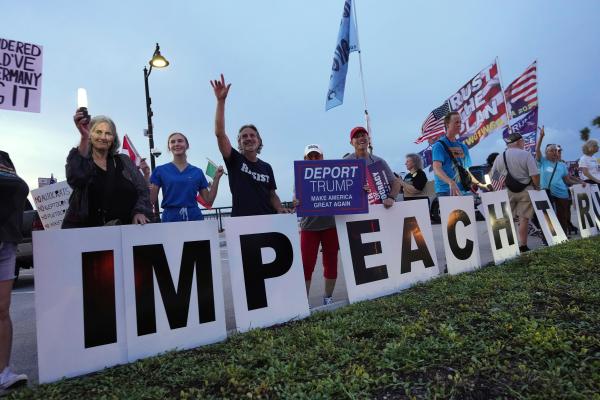 Good Trouble Lives On rally with sign IMPEACH TRUMP in Palm Beach, Florida.
