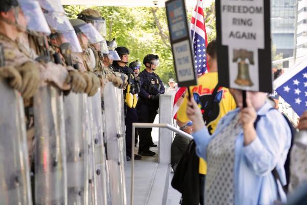 Protesters face off against Marines guarding the Federal Building in downtown Los Angeles