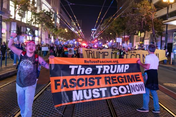 Trump Must Go Now banner in San Francisco Refuse Fascism march.