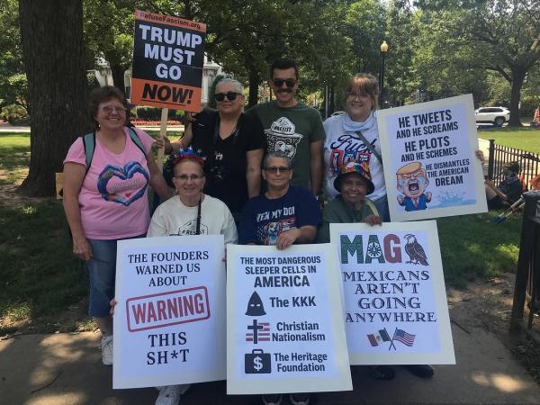 Group with signs at Refuse Fascism march Washington DC July 4, 2025 