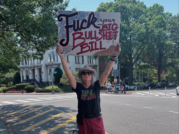 Sign at Refuse Fascism march in Washington DC: Fuck Your big Bullshit Bill