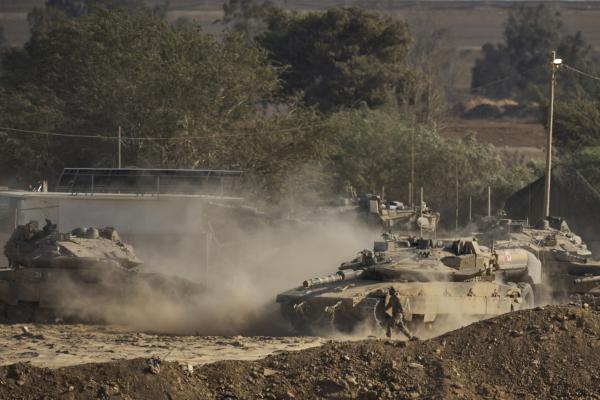 Israeli tanks move near the border of the Gaza Strip in southern Israel, August 6, 2025.
