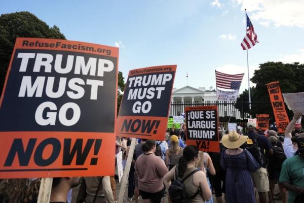 Refuse Fascism marchers and signs in front of White House, August 16, 2025.