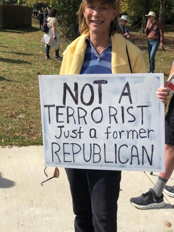 Protester at No Kings with sign: "Not a terrorist. Just a former Republican."