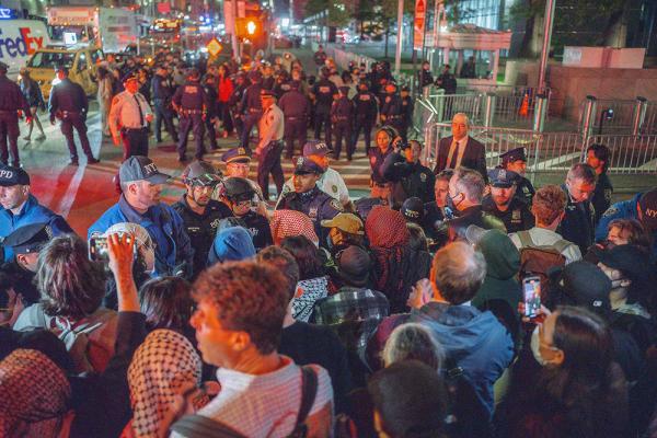 Protesters face off with police after an ICE raid on Canal Street, New York City, October 21, 2025.