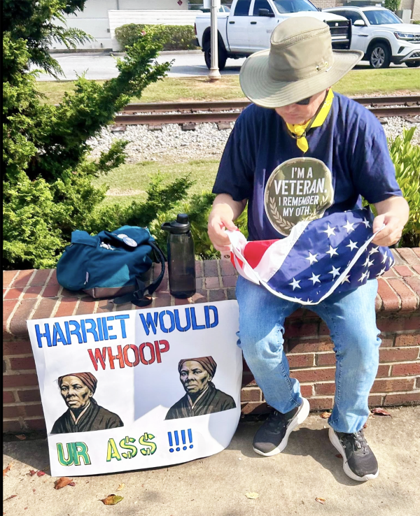 Woodstock, Georgia, man with sign: Harriet Tubman Would Whoop Ur A$$.