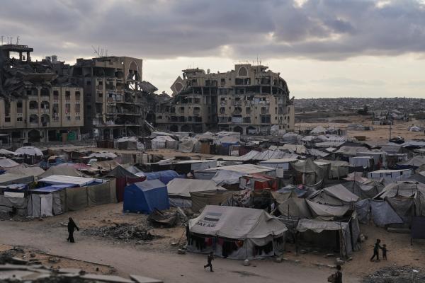 Tent camp for Palestinians bombed out of their homes (seen in the background) in Khan Younis, Gaza Strip, October 18.