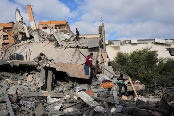 Palestinians inspect the rubble of the Abu Dalal family home in Nuseirat, October 29, 2025.