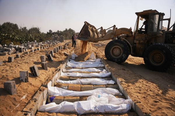 Unidentified Palestinian bodies returned from Israel are buried in a mass grave in Deir al-Balah, Gaza Strip, November 5, 2025.