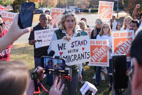 People protest ICE raids in Charlotte, NC, November 19, 2025.