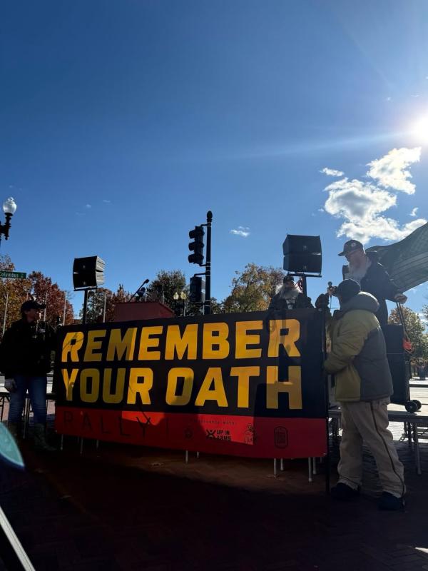 Remember your oath banner at Veterans Day rally, Union Station, Washington DC.