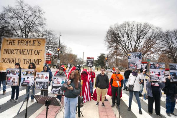 Reading The People's Indictment of Donald Trump in front of the White House, December 13, 2025. 