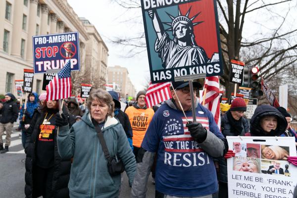 Protesters with signs Democracy has No Kings, December 13, 2025.