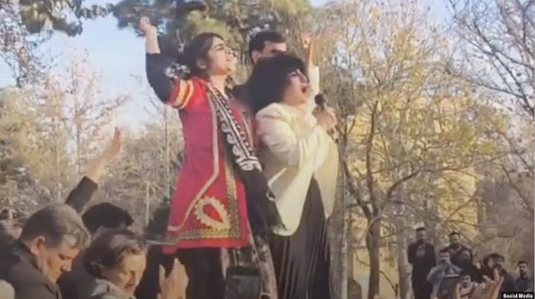 Leading crowd in chants at the 7th-day memorial: Sepideh Gholian, Narges Mohammadi, and the deceased’s brother Javad Alikordi.