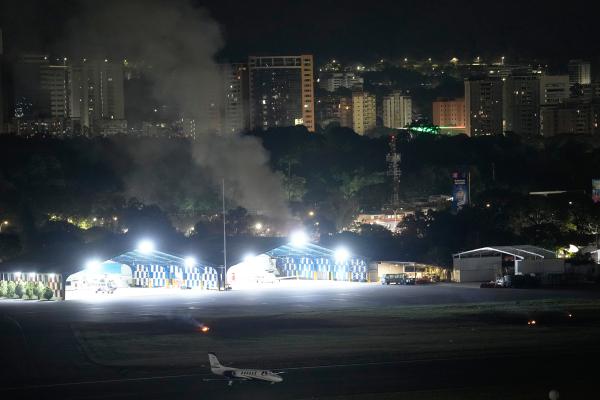 Smoke raises at La Carlota airport after explosions in Caracas, Venezuela, January 3, 2026.