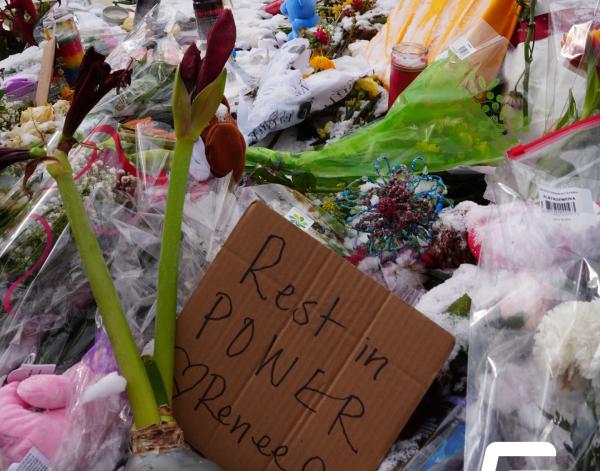Renee Nicole Good's memorial site with flowers and messages.
