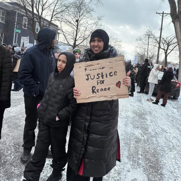 Mother and son march in protest, Minneapolis, January 10, 2026.
