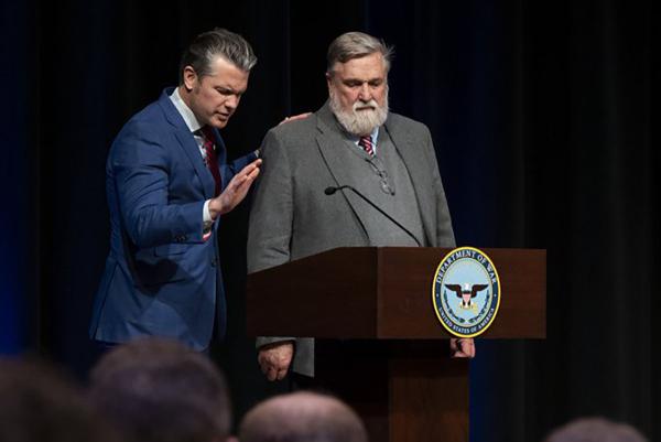 Pete Hegseth, left, prays with Moscow, Idaho, pastor Doug Wilson at the Pentagon in Virginia. 