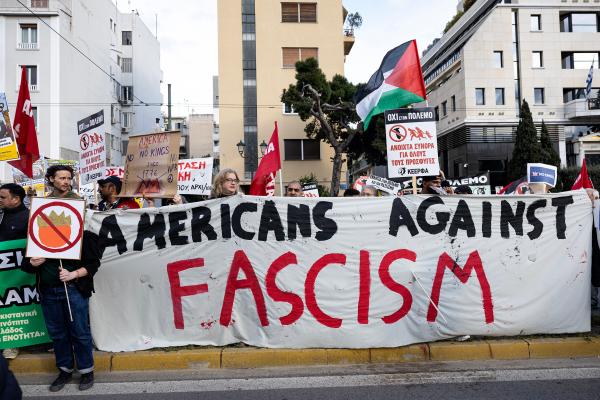 Protesters in Athens, Greece hold a banner "Americans Against Fascism" while protesting against the U.S. and Israeli war against Iran and Hezbollah, March 28, 2026.