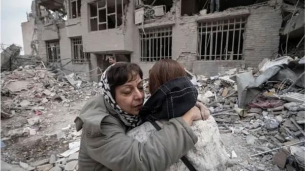 Iran - two women after bombing by U.S.