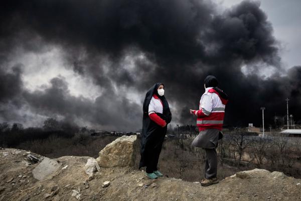 Smoke rises from a U.S.-Israeli strike on an oil factory in Tehran, Iran, March 8, 2026.