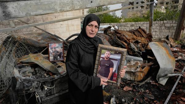 Lebanese Fadia Jeha, holds a portrait of her son Mohammed Dawee, 28, who was killed last week in an Israeli airstrike.