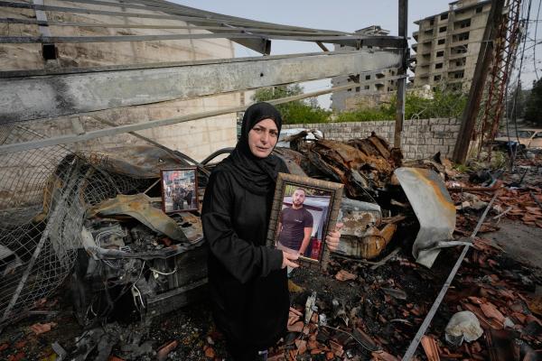 Lebanese Fadia Jeha, holds a portrait of her son Mohammed Dawee, 28, who was killed last week in an Israeli airstrike.