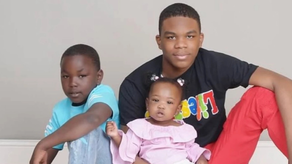 Emeshyon Wilkins in a family photo with his younger siblings, 2024