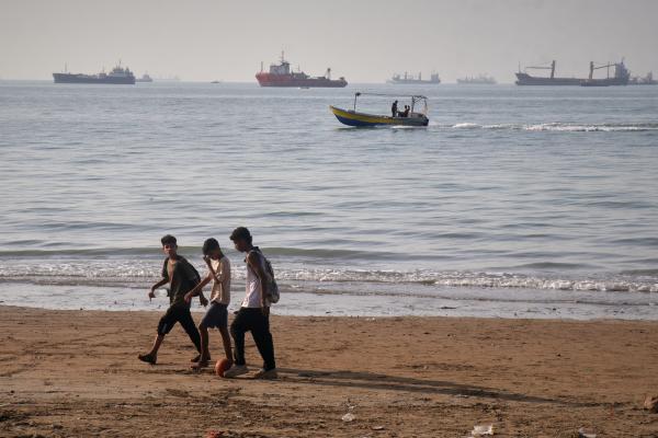  bulk carriers, cargo ships, and service vessels line the horizon in the Strait of Hormuz 