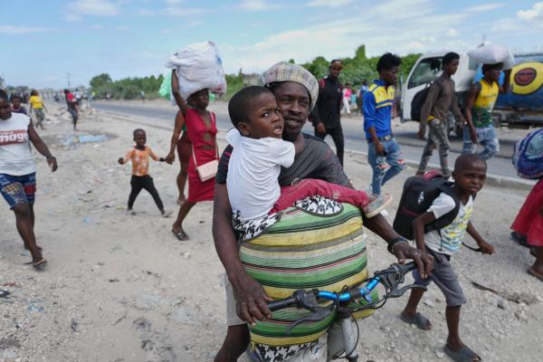 Haitians flee their homes to escape clashes between armed gangs in Port-au-Prince, Haiti, May 11, 2026.