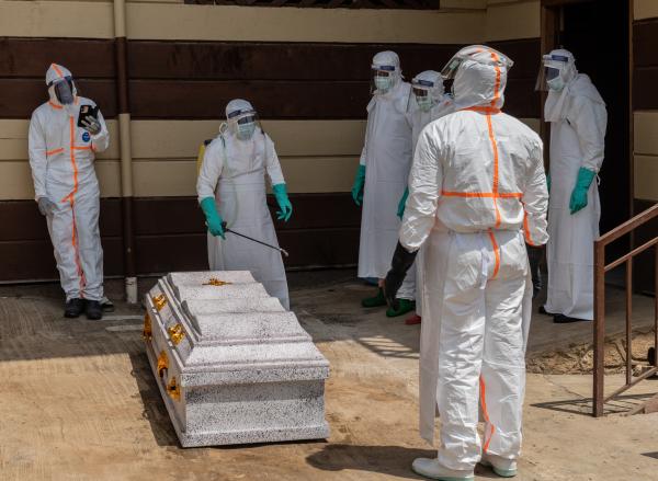 Congo health workers prepare the coffin of a university student who died of Ebola, June 12. 2026.