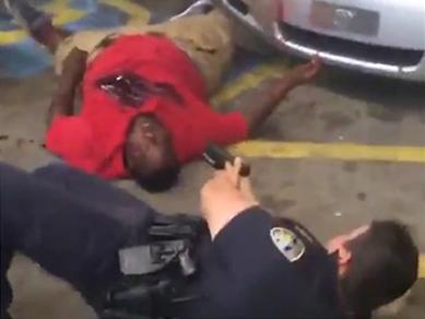 Screenshot of police aiming gun at Alton Sterling just before he was killed, July 5, 2016.