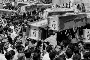 Iranians carrying coffins in the streets of Tehran of the victims of the U.S. airstrike against the Iranian commercial flight 655