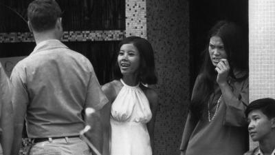 Women at a bar and passing U.S. soldiers in Saigon on May 28, 1971.