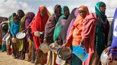 Climate refugees lined up for water