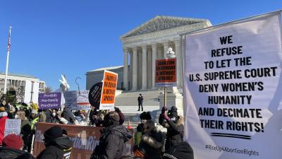 RiseUp4AbortionRights contingent at SCOTUS with banners.